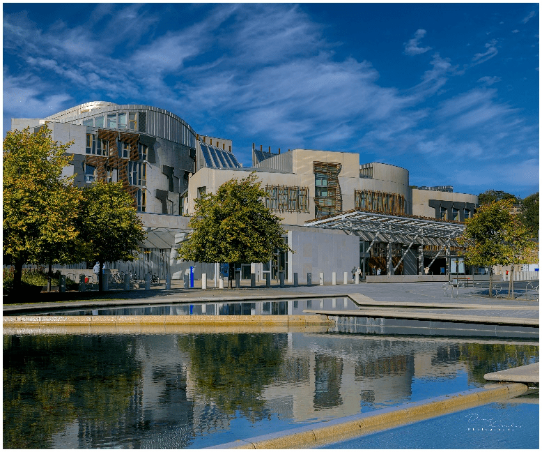 a castle surrounded by a body of water